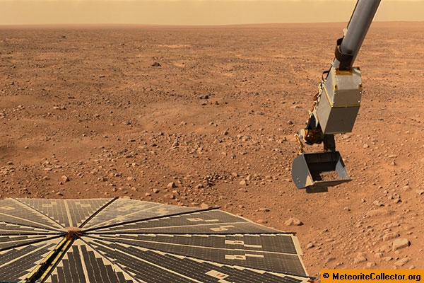 The Phoenix Lander arm collects a soil sample on Mars